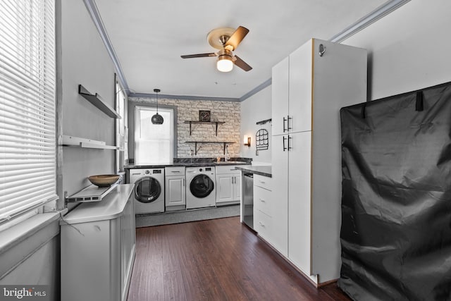 clothes washing area featuring crown molding, dark wood-style flooring, ceiling fan, a sink, and independent washer and dryer