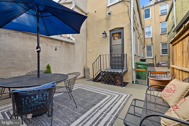 view of patio featuring outdoor dining area