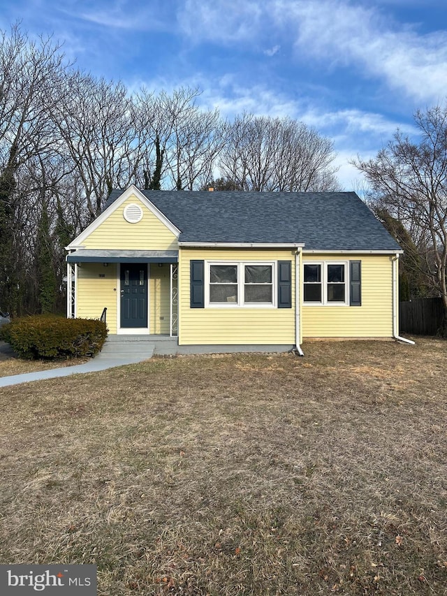 ranch-style home with a shingled roof