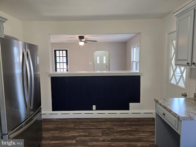 kitchen with light countertops, ceiling fan, dark wood-style flooring, and freestanding refrigerator