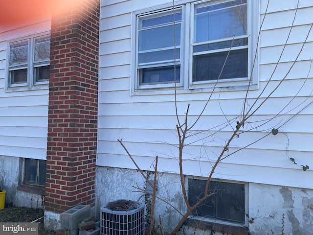 details with central AC and brick siding