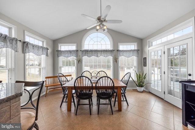 sunroom / solarium featuring lofted ceiling and ceiling fan