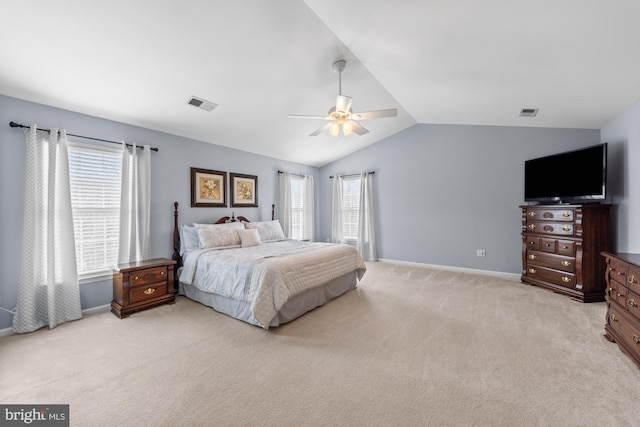 bedroom with light carpet, baseboards, visible vents, ceiling fan, and vaulted ceiling