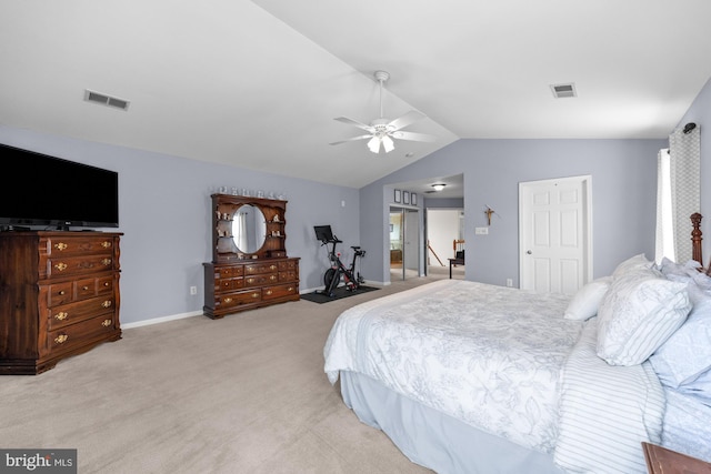 bedroom with lofted ceiling, visible vents, light carpet, and baseboards