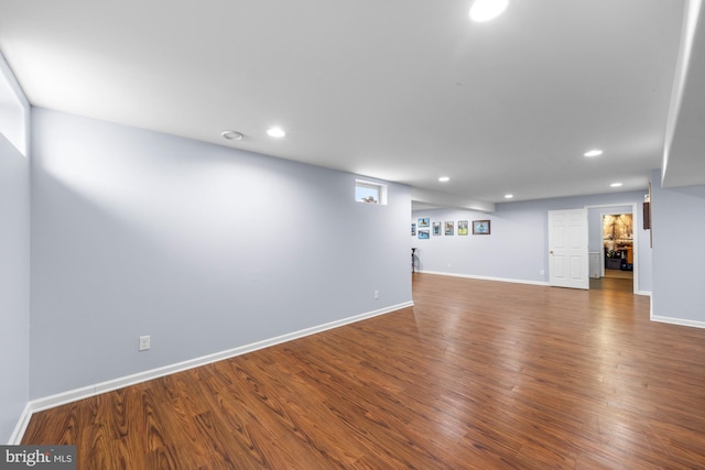 interior space featuring baseboards, wood finished floors, and recessed lighting