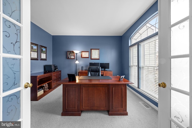 office featuring visible vents and light colored carpet