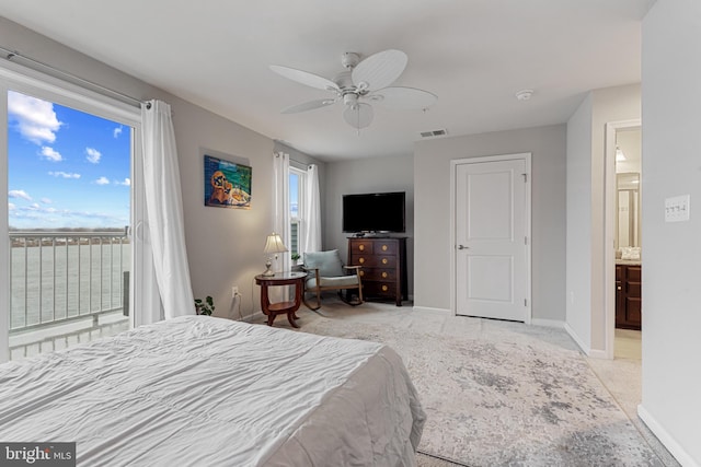 bedroom featuring access to exterior, baseboards, visible vents, and a ceiling fan