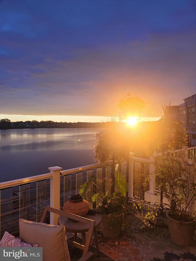 exterior space with a balcony and a water view