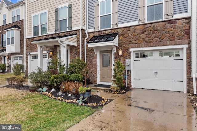 view of property featuring a garage, stone siding, and a residential view