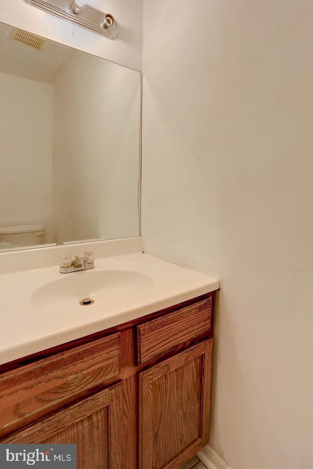 bathroom with visible vents and vanity