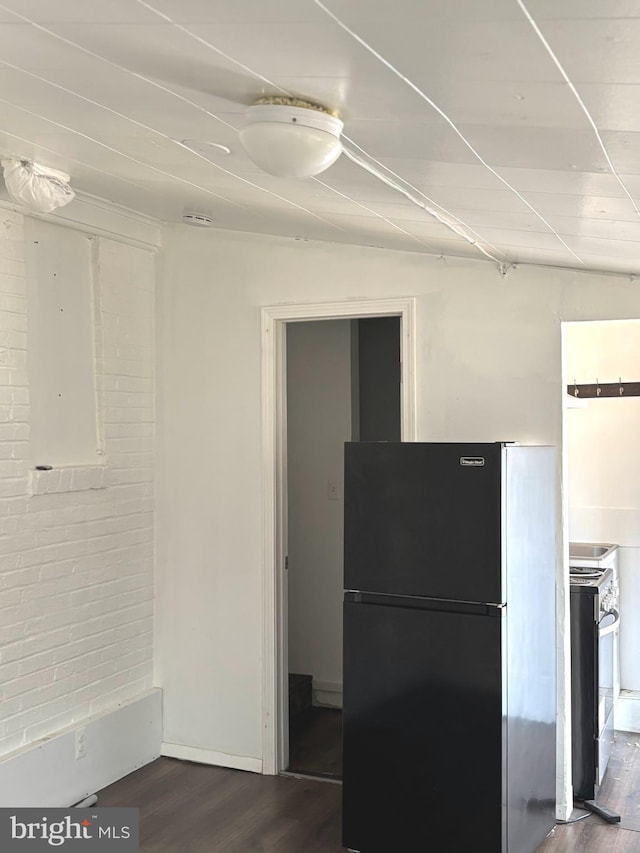 kitchen with dark wood-style floors, freestanding refrigerator, and stainless steel electric range oven