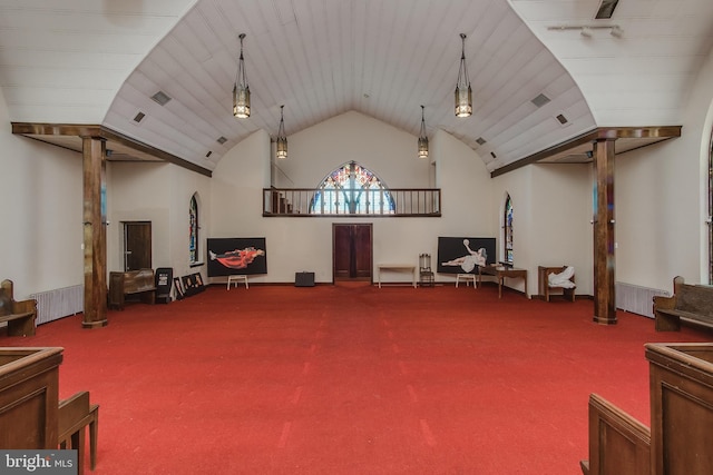 misc room featuring visible vents, high vaulted ceiling, carpet flooring, and decorative columns