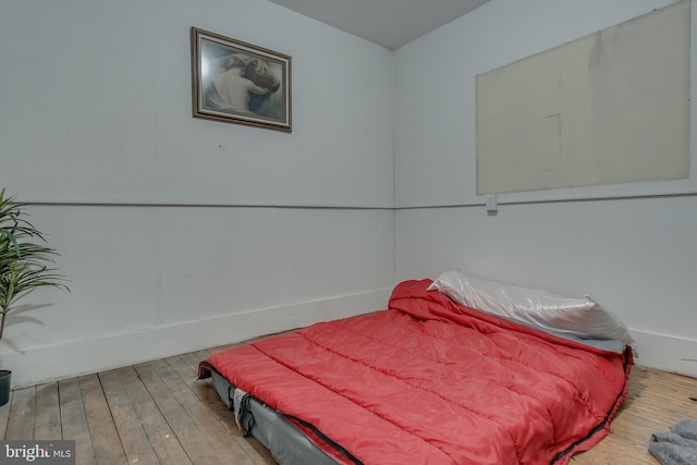 bedroom featuring wood finished floors