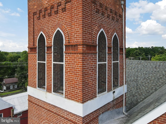 view of property exterior featuring brick siding