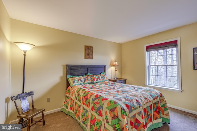 bedroom featuring carpet flooring and baseboards