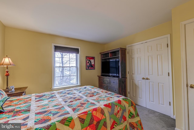 carpeted bedroom featuring a closet