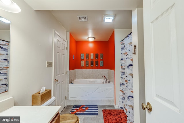 full bath with tile patterned flooring, visible vents, a bath, and vanity