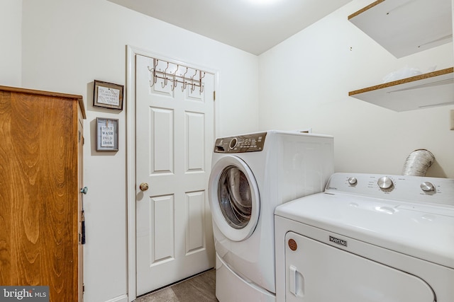 clothes washing area with laundry area and washing machine and dryer