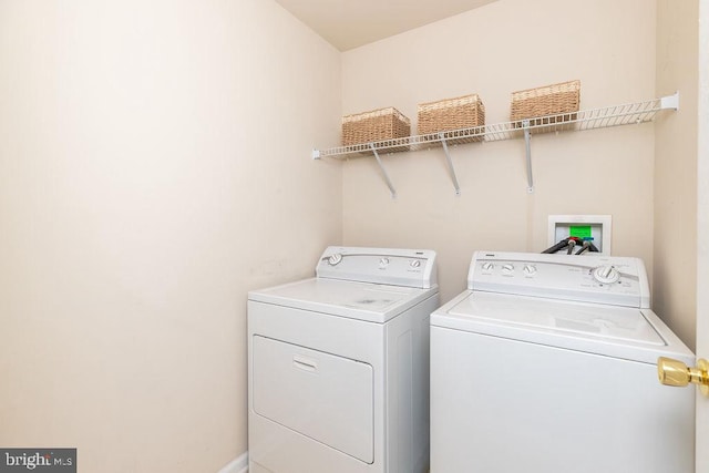 laundry room with laundry area and washing machine and dryer