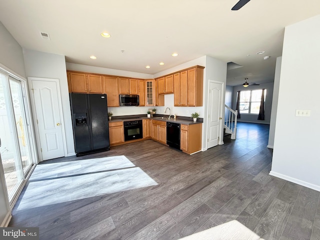 kitchen featuring black appliances, dark wood-style floors, visible vents, and ceiling fan