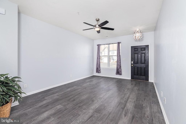 foyer with baseboards, ceiling fan, and dark wood-style flooring