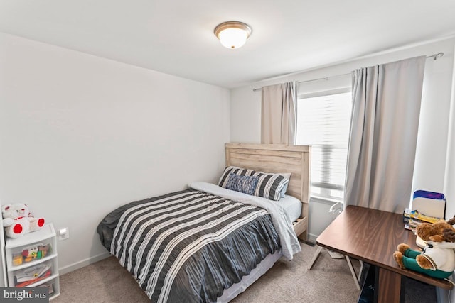 carpeted bedroom with baseboards