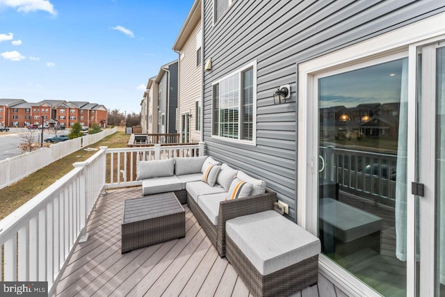 wooden deck with a residential view and an outdoor living space