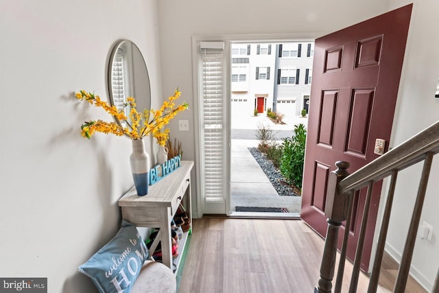 entryway featuring stairs and wood finished floors