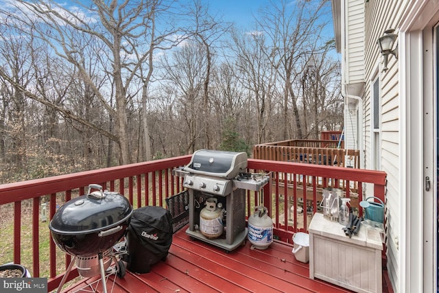 wooden terrace with area for grilling