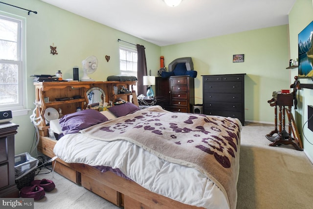 carpeted bedroom with baseboards