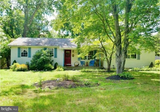 ranch-style home featuring a front yard