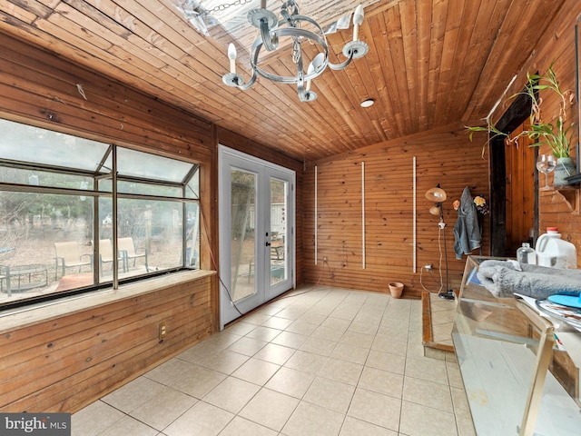 unfurnished sunroom featuring french doors, wood ceiling, an inviting chandelier, and vaulted ceiling