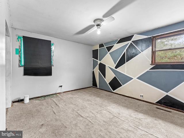 empty room with carpet flooring and ceiling fan