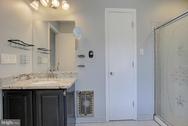 full bathroom with tile patterned floors, visible vents, a shower stall, and vanity