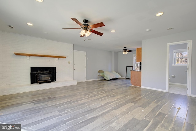 unfurnished living room featuring visible vents, wood finished floors, recessed lighting, baseboards, and ceiling fan