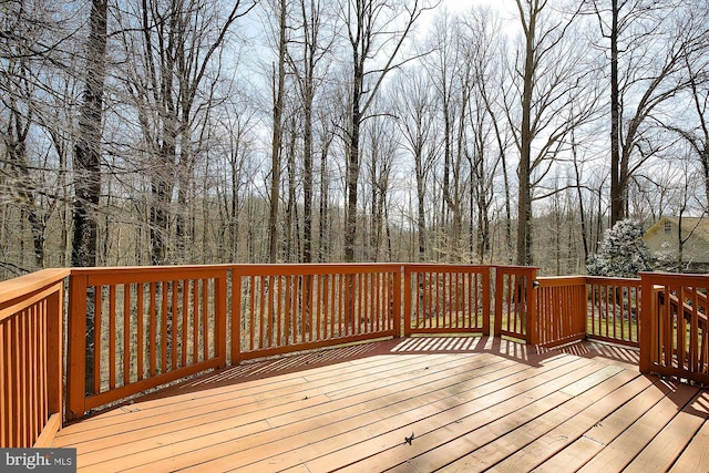 wooden terrace with a forest view