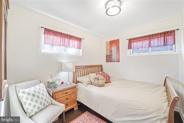 bedroom featuring dark wood-style floors