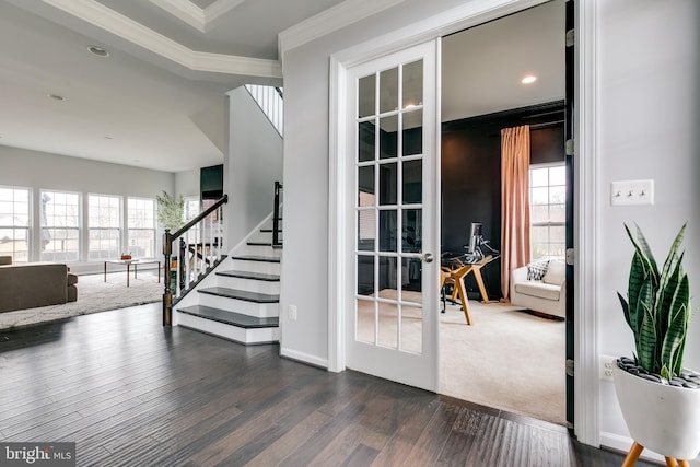 doorway with dark wood-style floors, a healthy amount of sunlight, french doors, and ornamental molding