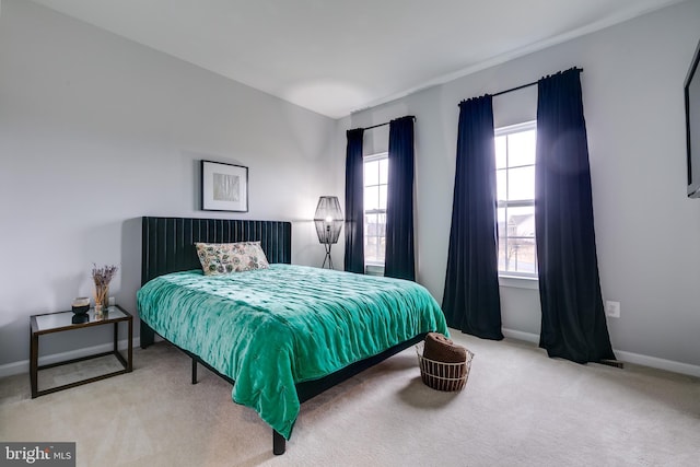 carpeted bedroom with baseboards