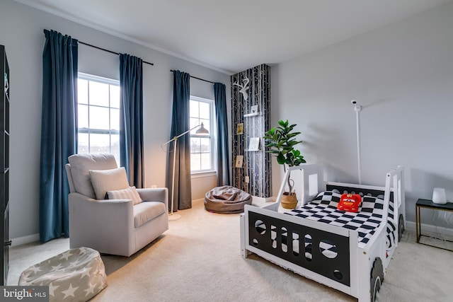 carpeted bedroom with baseboards