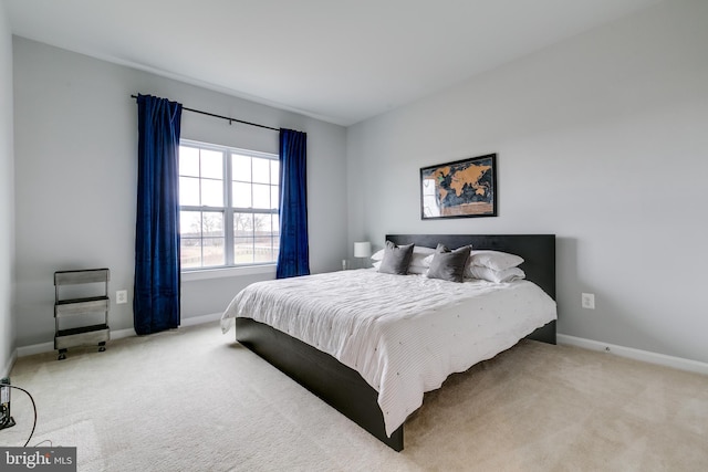 bedroom with carpet flooring and baseboards