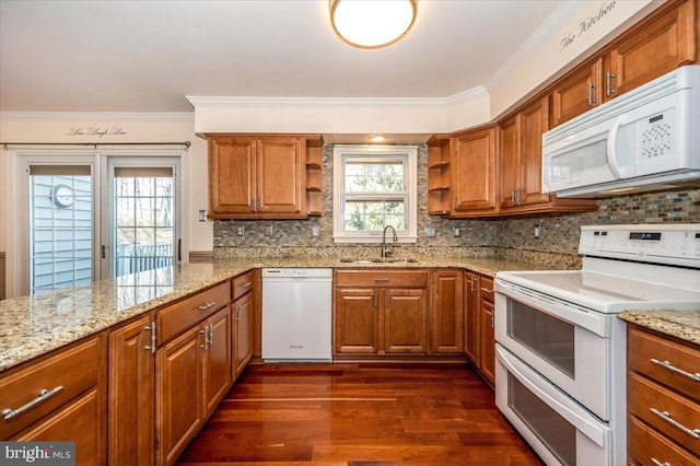 kitchen with open shelves, ornamental molding, brown cabinets, white appliances, and a sink