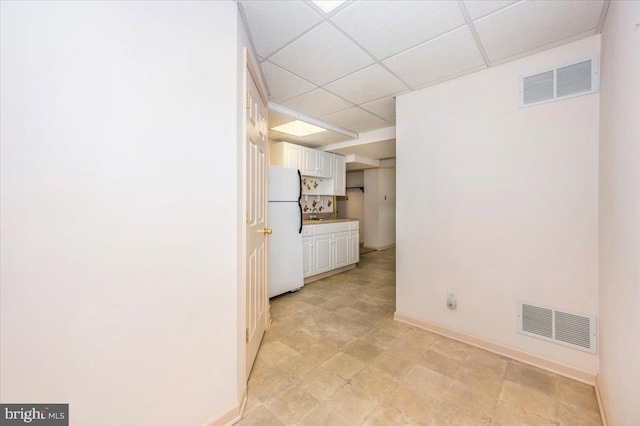 interior space with visible vents and baseboards