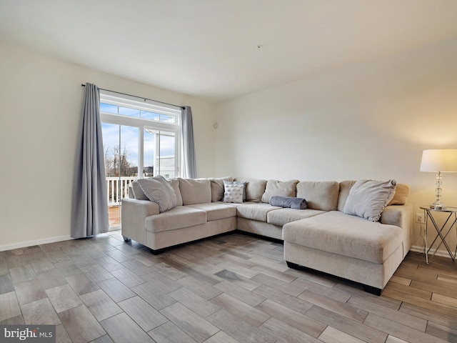 living room with wood finish floors and baseboards