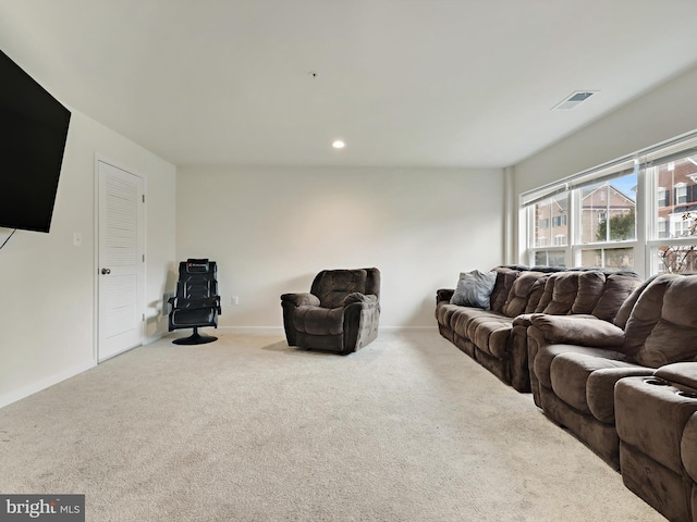 carpeted living room with baseboards, visible vents, and recessed lighting