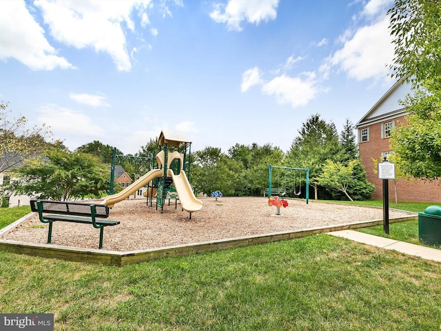 community jungle gym featuring a lawn