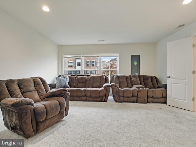 living room with carpet floors, visible vents, and recessed lighting