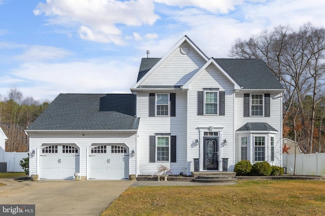 view of front of house with a garage, fence, driveway, roof with shingles, and a front lawn