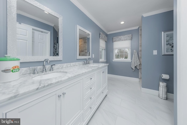 full bathroom featuring baseboards, ornamental molding, and a sink