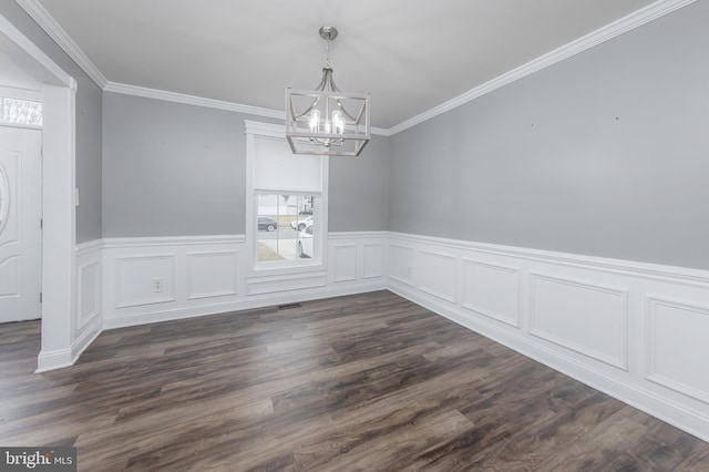 unfurnished dining area featuring a chandelier, visible vents, dark wood finished floors, and ornamental molding